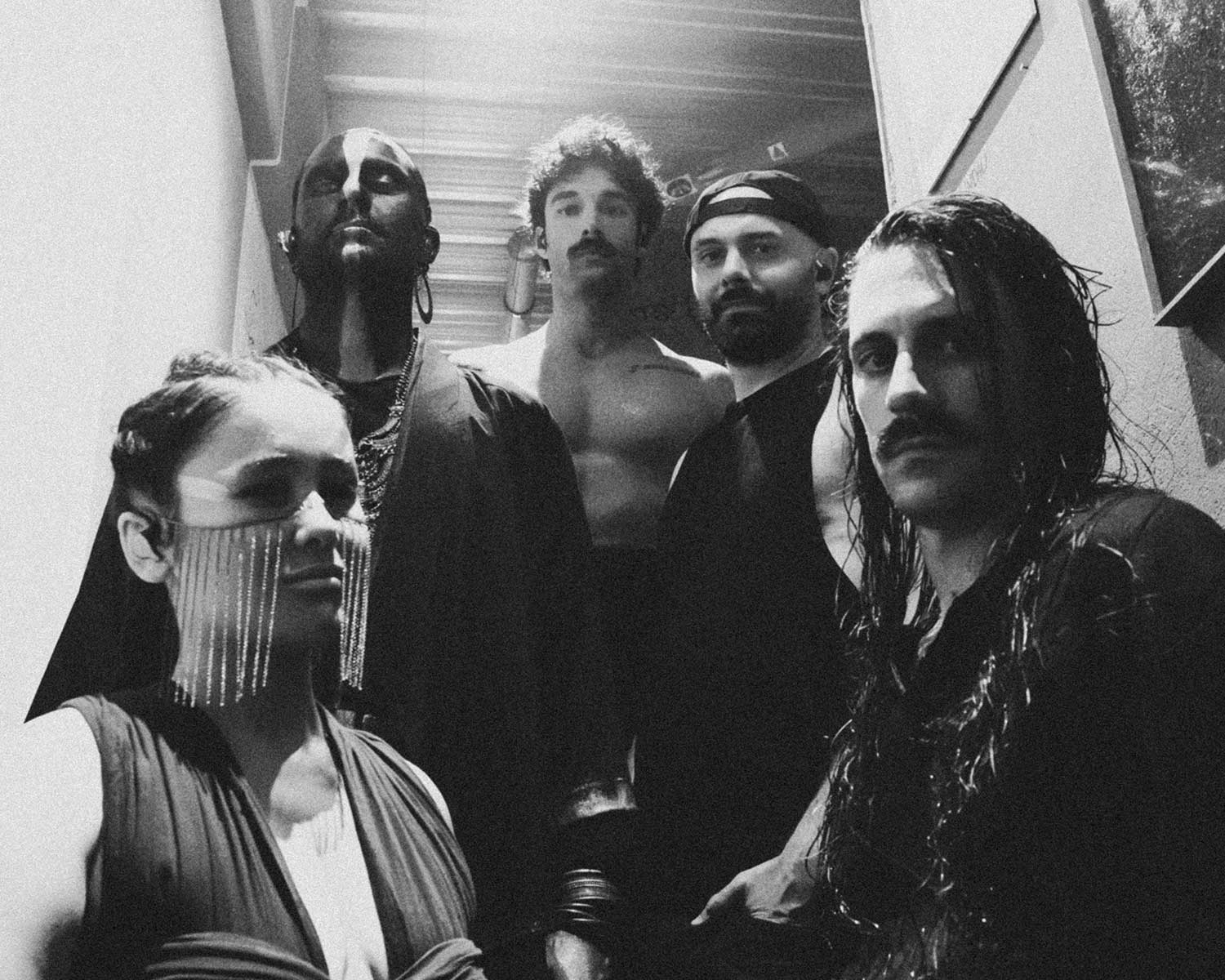 The members of IGORRR pose together in black and white.